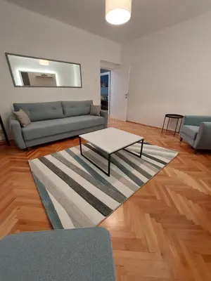 a living room with a couch and a coffee table at Dalmatinska apartment in Belgrade
