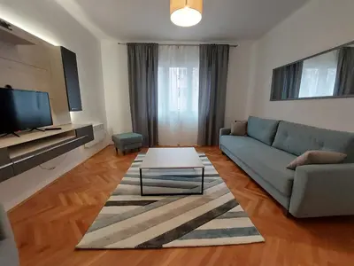 a living room with a couch and a table at Dalmatinska apartment in Belgrade
