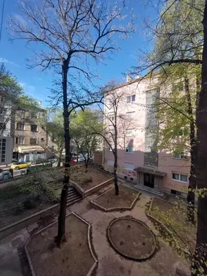 a park in front of a building with trees at Dalmatinska apartment in Belgrade