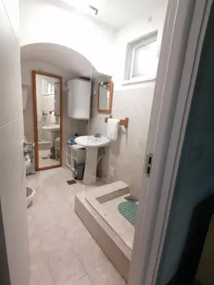 a bathroom with a sink and a toilet at Apartman Dunja S in Belgrade