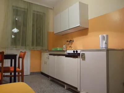 a kitchen with a refrigerator and a counter top at Georgina in Rospi Ćuprija