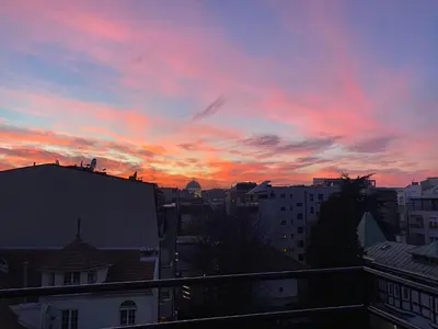 a sunset view from the balcony of a city at Panorama Royal Vračar in Vračar (historical)