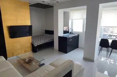 a living room with a couch and a table at Lux Spa Apartman na Vračaru in Vračar (historical)