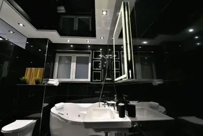 a bathroom with a sink and a mirror and a toilet at Lux Spa Apartman na Vračaru in Vračar (historical)