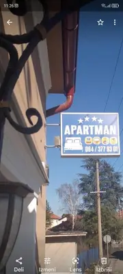 a sign for anarmaarma restaurant on the side of a building at Apartman Hrkalovic in Arandjelovac