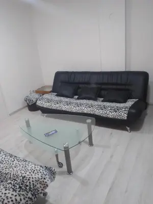 a living room with a couch and a coffee table at Apartman Hrkalovic in Arandjelovac