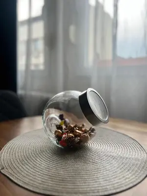 a glass bowl of food on a table with a spoon at Apartman Lena in Belgrade
