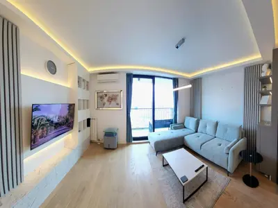 a living room with a couch and a table at Belgrade Waterfront 10th fl Lux Apt. w/ City view in Belgrade