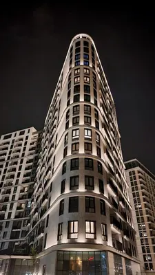 a tall building at night with its lights on at Belgrade Waterfront 10th fl Lux Apt. w/ City view in Belgrade