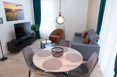 a living room with a table and a couch at Tommy BW in Belgrade