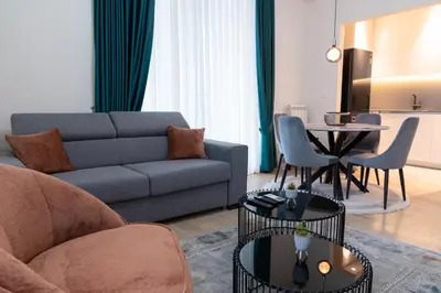 a living room with a couch and a table at Tommy BW in Belgrade
