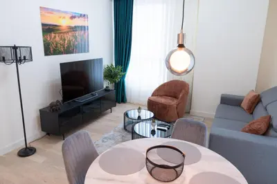 a living room with a couch and a table at Tommy BW in Belgrade