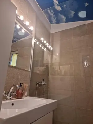 a bathroom with a sink and a mirror at HEART OF BELGRADE cozy LUX APARTMENT in Belgrade
