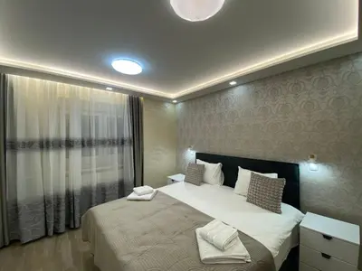 a bedroom with a large bed and a window at Daca 2 in Belgrade