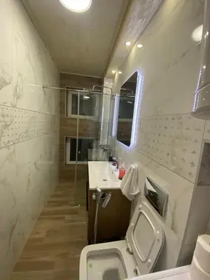 a bathroom with a toilet and a sink and a mirror at Daca 2 in Belgrade