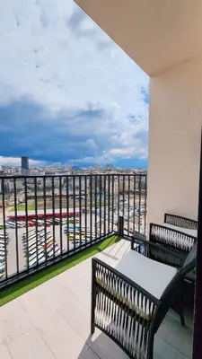 a balcony with two benches and a view of a city at Belgrade Waterfront 16th fl Lux Apt. w/ City view in Belgrade