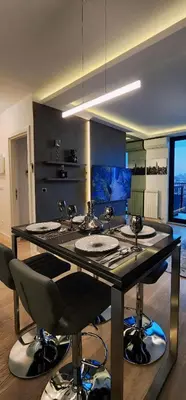 a large bathroom with four sinks and a counter with a barraud at Belgrade Waterfront 16th fl Lux Apt. w/ City view in Belgrade