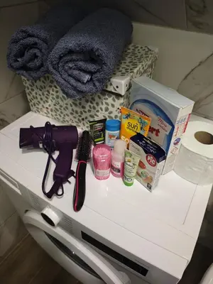 a white table with products on top of it at Dunja Apartmans in Belgrade