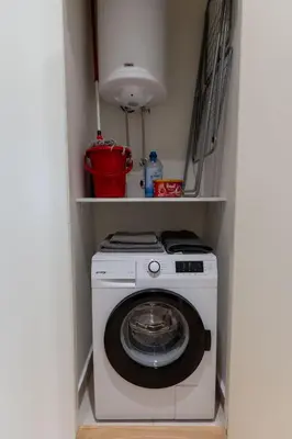 a washer and dryer in a small room at Lovely Studio Apartment - Belgrade Waterfront - Free Parking in Belgrade