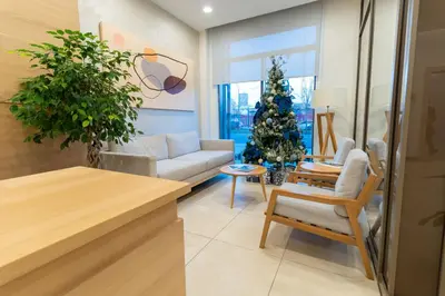 a living room with a christmas tree and a couch at Lovely Studio Apartment - Belgrade Waterfront - Free Parking in Belgrade