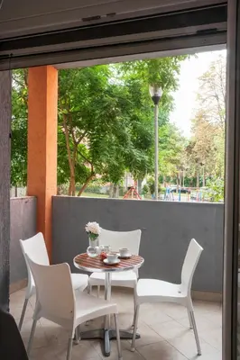 a table and chairs sitting on a patio at Dorotea Lux in Belgrade