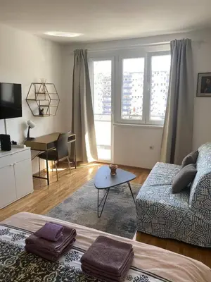 a living room with a couch and a table at Apartment Bruno NICE PLACE in Belgrade
