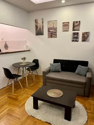 a living room with a couch and a table at Apartment ARENA 28 in Belgrade