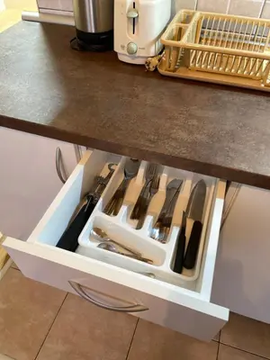 a drawer in a kitchen with cooking utensils at Apartman Helena in Lazarevac