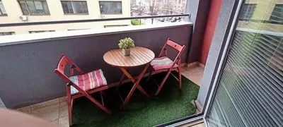 a small table and two chairs on a balcony at Despot 105 in Belgrade