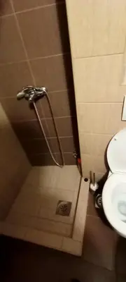 a bathroom with a shower with a toilet and a sink at Despot 105 in Belgrade