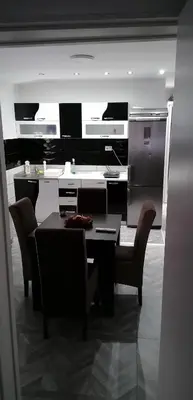 a dining room with a table and chairs at YOUR home in Belgrade
