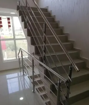 a staircase with a metal railing in a building at YOUR home in Belgrade