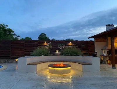 a fire pit in the middle of a patio at Vila Ruža Vetra in Belgrade