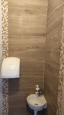 a bathroom with a sink and a toilet at Vila Ruža Vetra in Belgrade