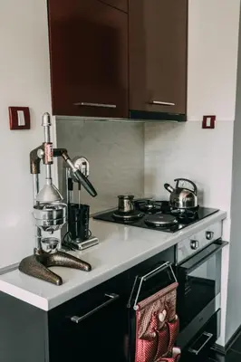 a kitchen with a stove with pots and pans on it at Smart hostel in Belgrade