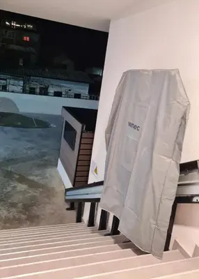 a white tent sitting on the side of a building at Stella Apartman Ruma in Ruma