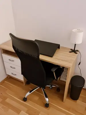 a desk with a chair and a laptop on it at Maksim in Vračar (historical)