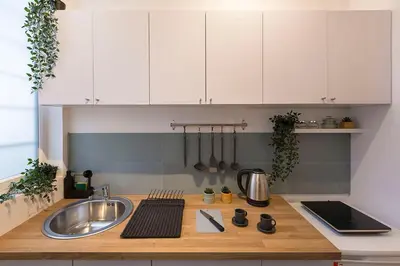 a kitchen with a sink and a counter top at High Note Apartment in Belgrade