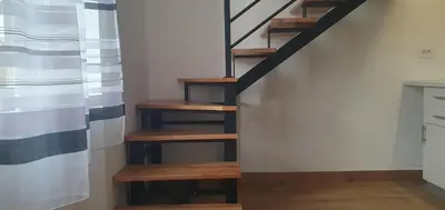 a staircase with wooden steps in a room at BEL GALLERIES ( Karadjordjeva street ) in Sajmište
