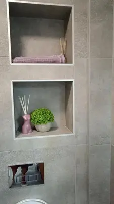 a bathroom with two shelves with a plant on it at La Vista in Stari Banovci