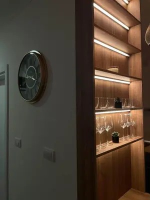 a clock on a wall with wine glasses at La Vista in Stari Banovci