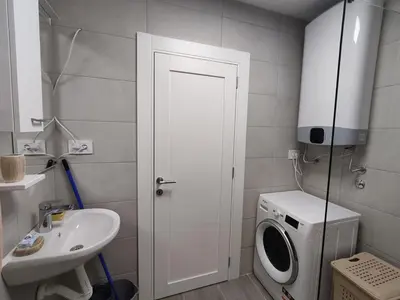 a bathroom with a washing machine and a sink at Zarkovo in Belgrade