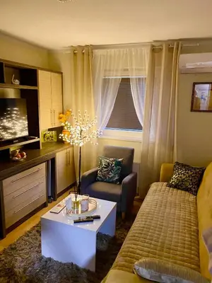 a living room with a couch and a table at Santa Barbara Apartment in Belgrade