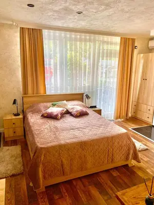 a bedroom with a bed with two pillows on it at Santa Barbara Apartment in Belgrade