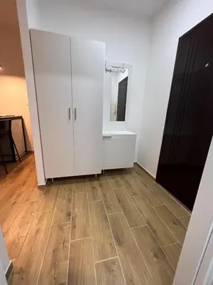 a room with a white cabinet and a mirror at Apartment 55 Belgrade in Belgrade
