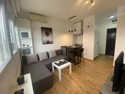 a living room with a couch and a table at Apartment 55 Belgrade in Belgrade