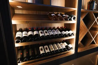 a wine cabinet filled with lots of wine bottles at Hotel Sumadija in Belgrade