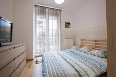 a bedroom with a bed and a flat screen tv at Belgrade apartment Skadarlija in Belgrade