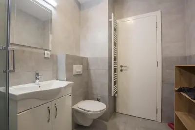 a bathroom with a white sink and a toilet at Belgrade apartment Skadarlija in Belgrade