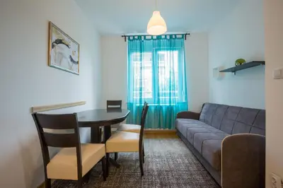 a living room with a couch and a table at Belgrade apartment Skadarlija in Belgrade